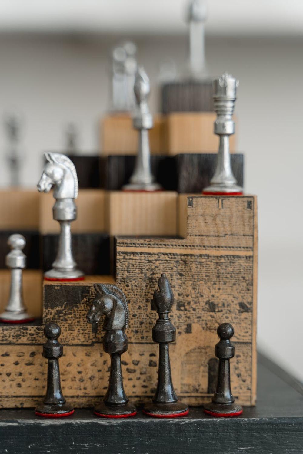 chess_pieces_on_wooden_shelf